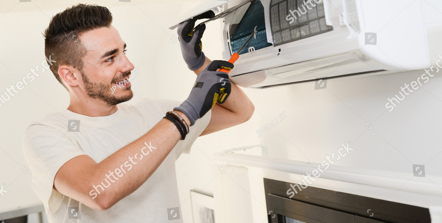 stock-photo-handsome-young-man-electrician-installing-air-conditioning-in